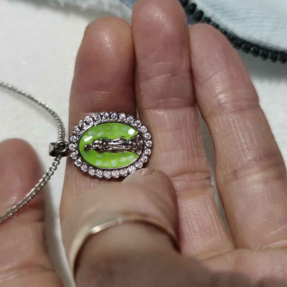 This religious necklace stainless steel  with rinestones chain is 16 inches